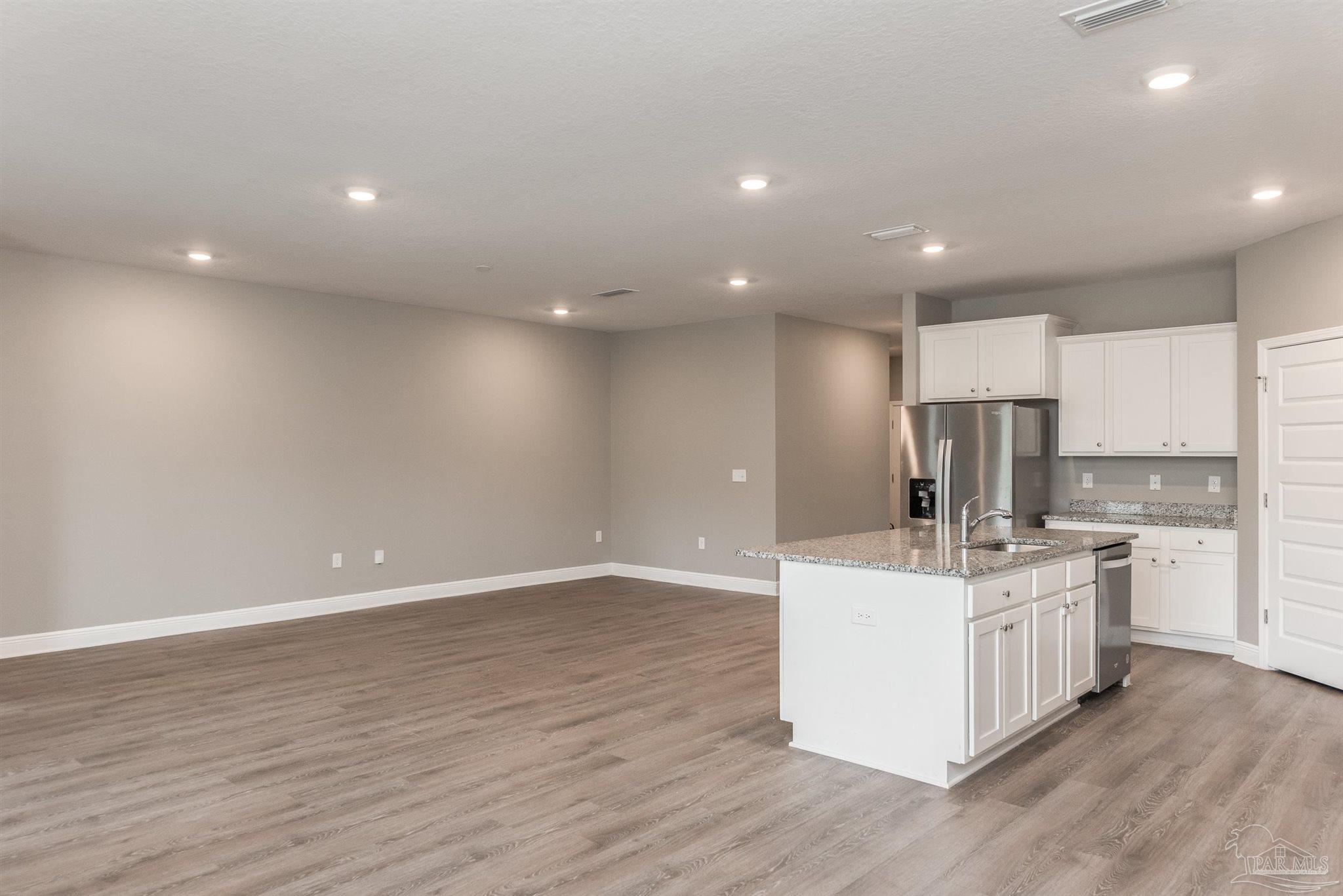 7882 Burnside Loop Pensacola, FL 32526 - Photo 11 of 28 a view of kitchen with stainless steel appliances granite countertop a stove and a sink