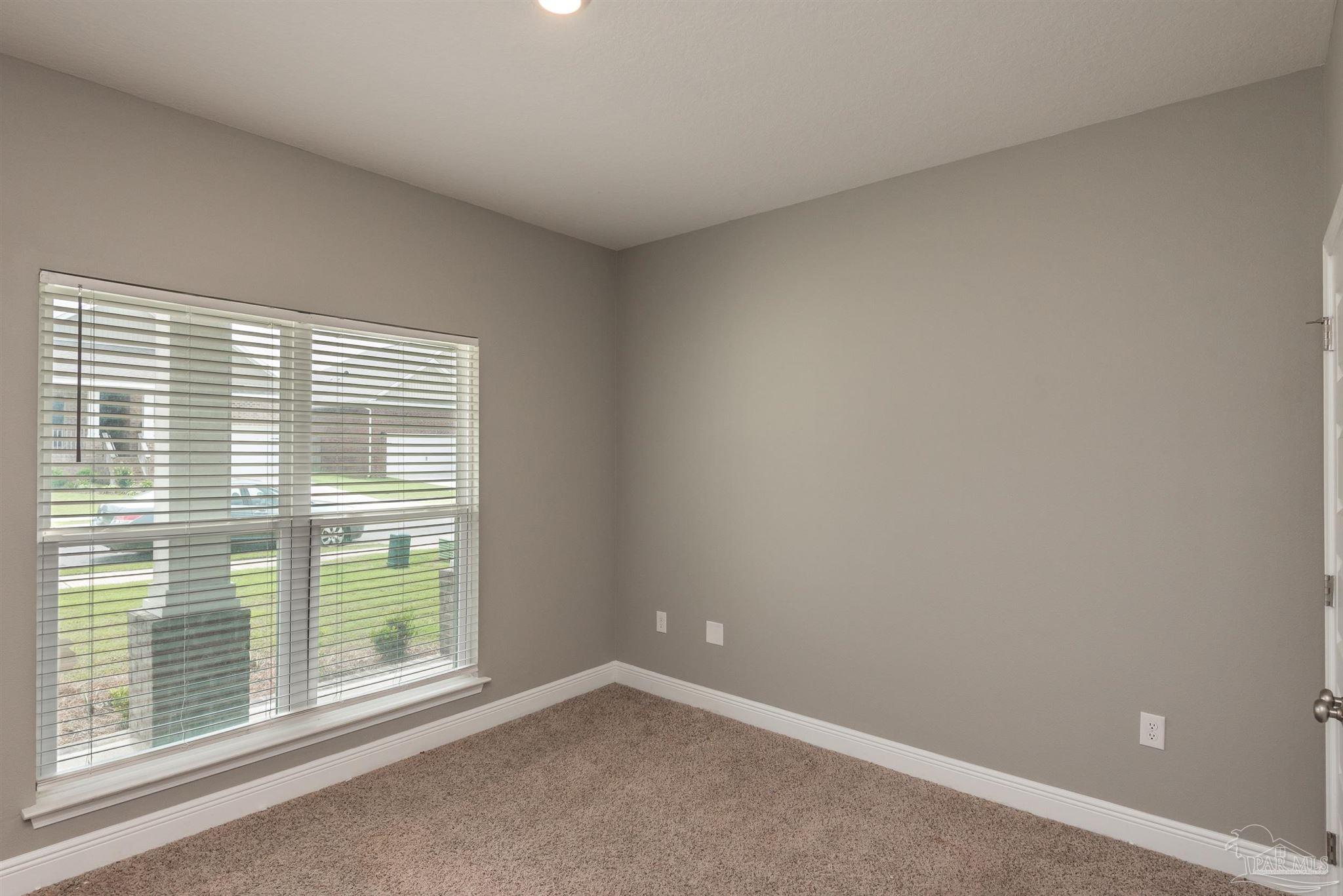 7882 Burnside Loop Pensacola, FL 32526 - Photo 13 of 28 a view of an empty room with a window