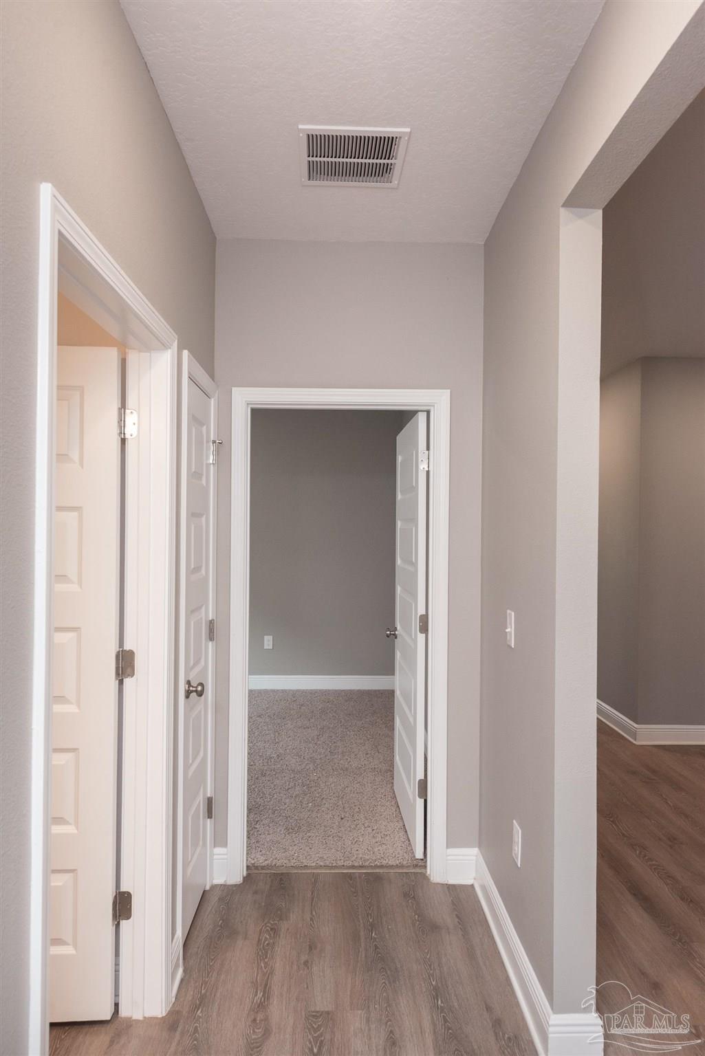 7882 Burnside Loop Pensacola, FL 32526 - Photo 15 of 28 a view of a hallway with wooden floor