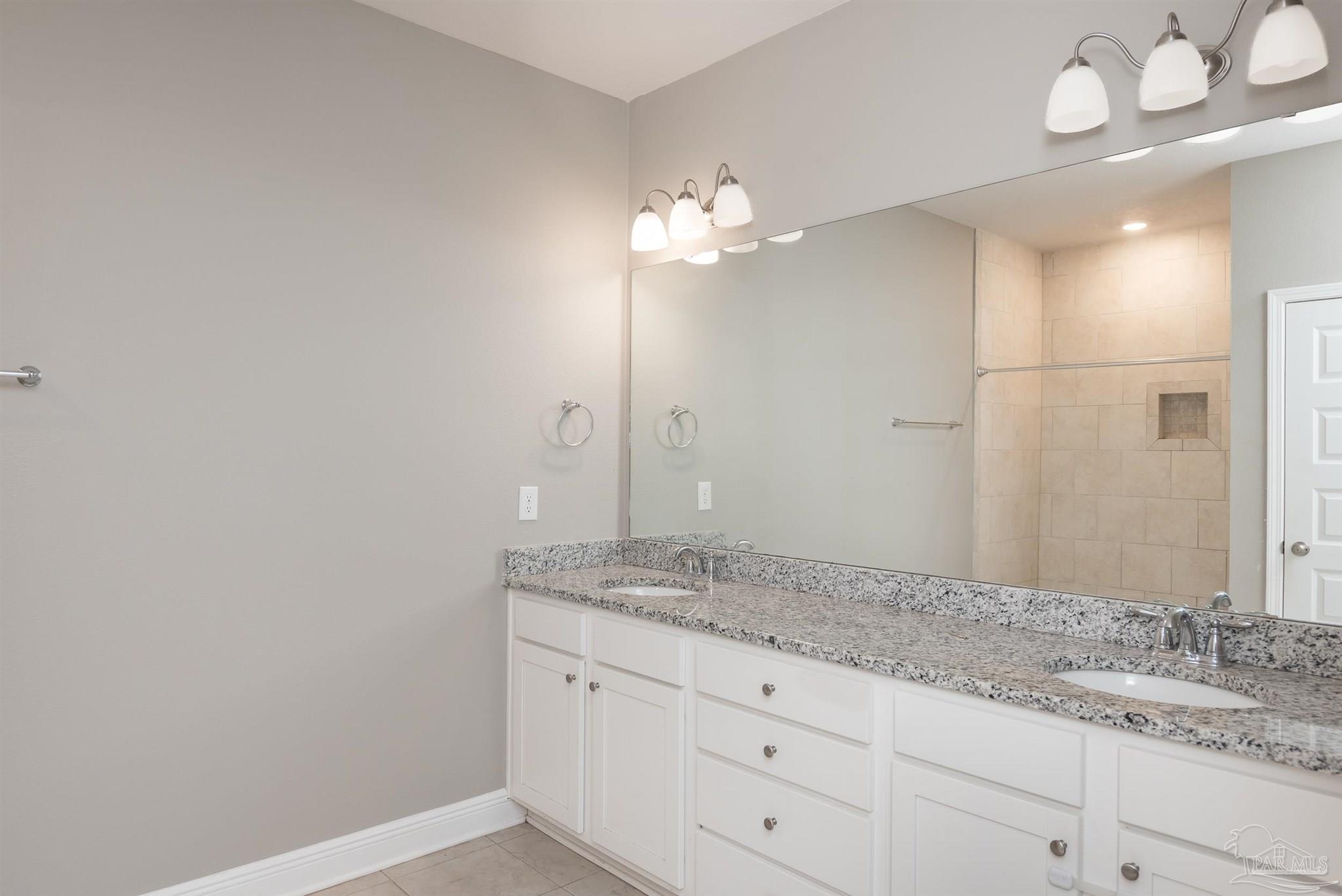 7882 Burnside Loop Pensacola, FL 32526 - Photo 22 of 28 a bathroom with a granite countertop double vanity sink and a mirror