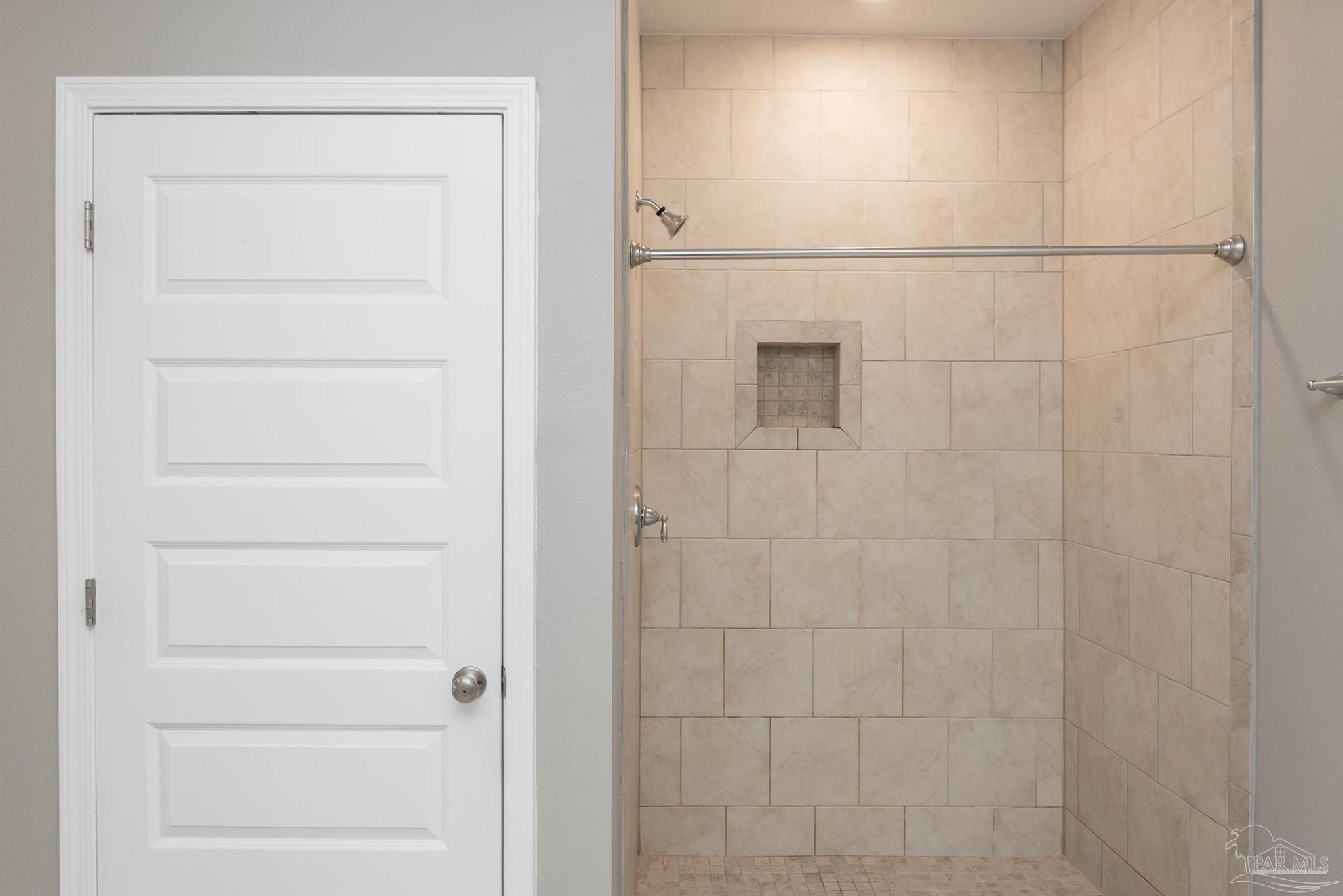 7882 Burnside Loop Pensacola, FL 32526 - Photo 24 of 28 a bathroom with a shower