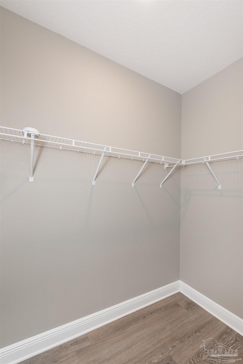 7882 Burnside Loop Pensacola, FL 32526 - Photo 25 of 28 a view of a room with racks on the wall