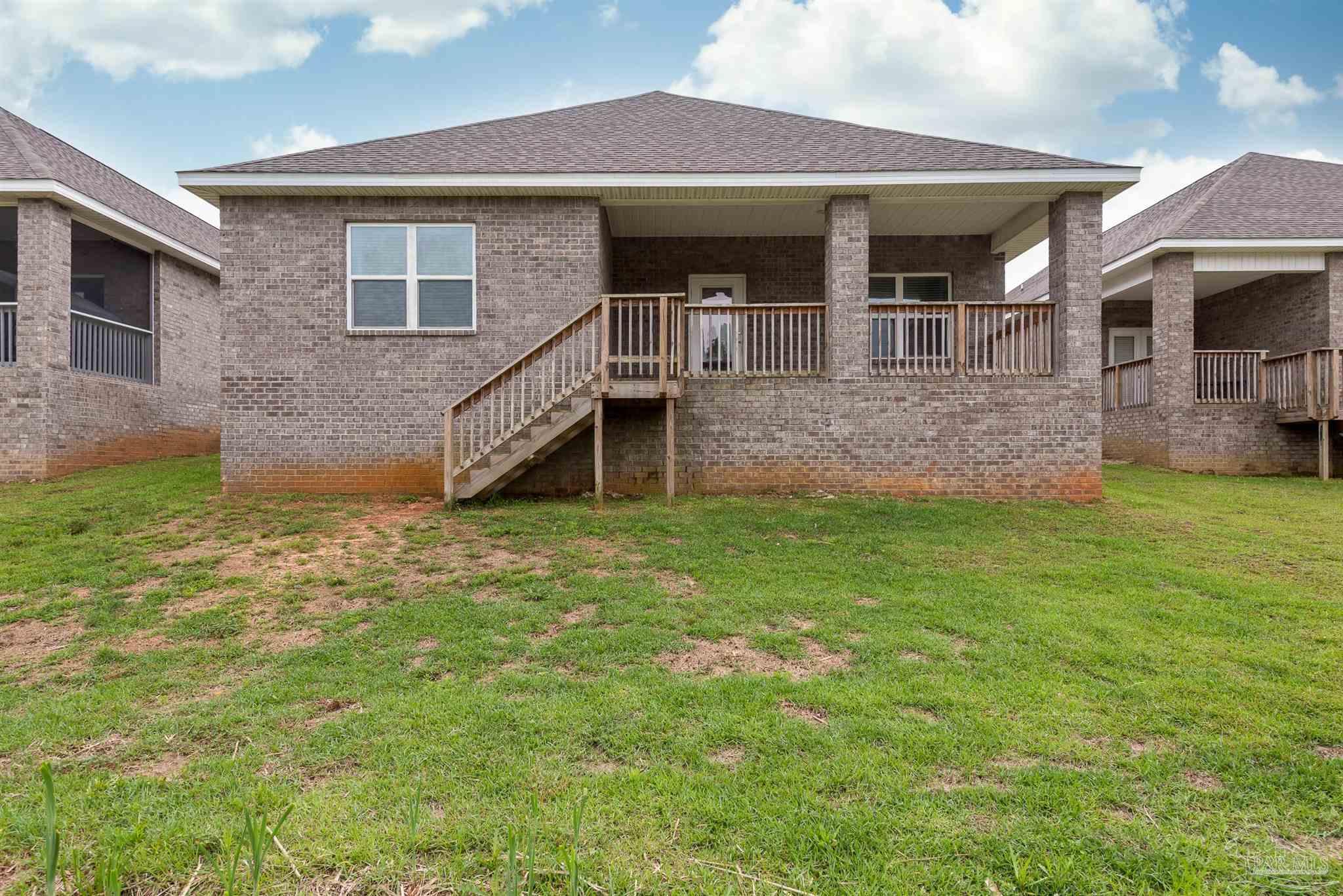 7882 Burnside Loop Pensacola, FL 32526 - Photo 5 of 28 a front view of a house with a yard