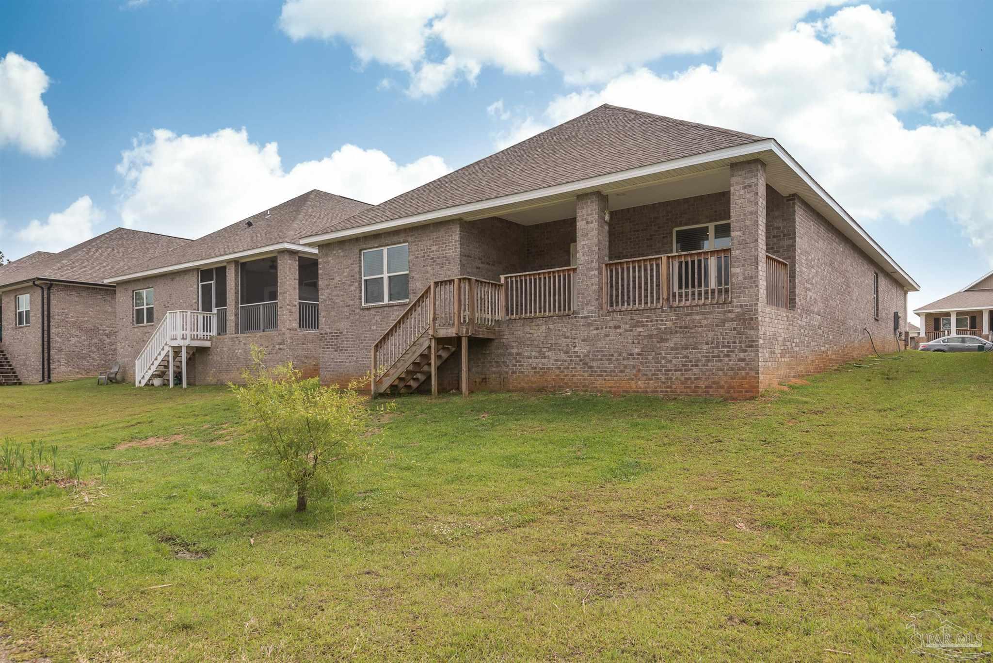 7882 Burnside Loop Pensacola, FL 32526 - Photo 8 of 28 a front view of a house with a garden