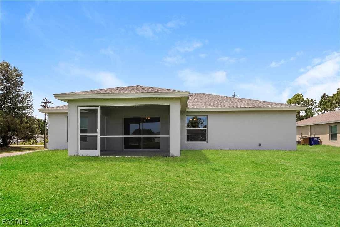 2900 7th Street West Lehigh Acres, FL 33971 - Photo 15 of 15 front view of a house with a yard
