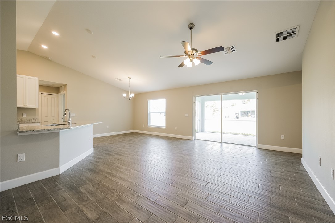 2900 7th Street West Lehigh Acres, FL 33971 - Photo 3 of 15 a view of an empty room with window and wooden floor