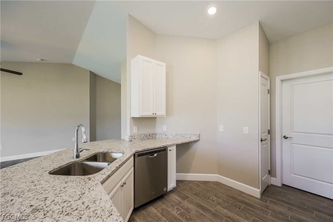 2900 7th Street West Lehigh Acres, FL 33971 - Photo 6 of 15 a kitchen with a sink and cabinets