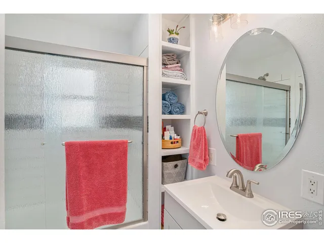 a living room with furniture and painting on the wall