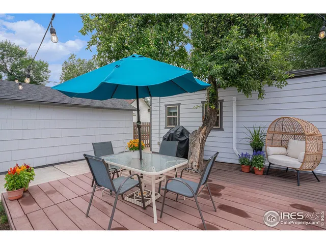 a view of a house with a backyard and a patio