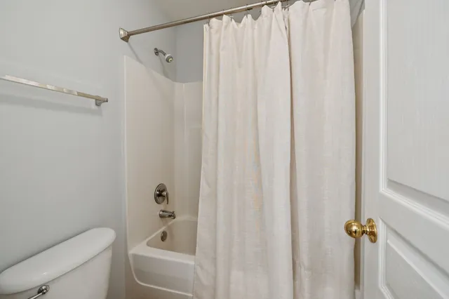 a bathroom with a shower curtain