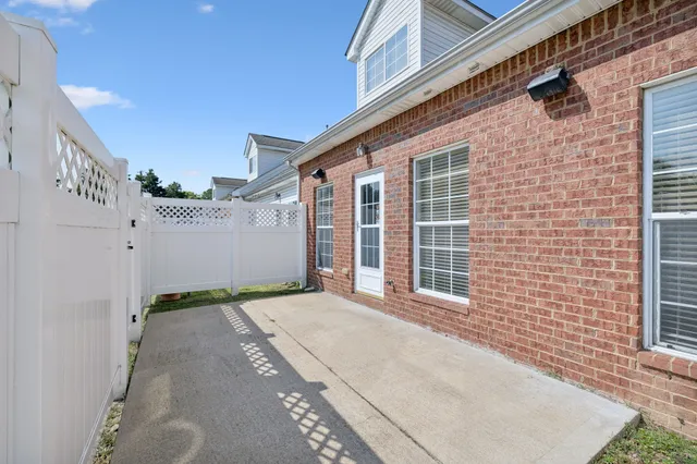 a view of backyard with a balcony