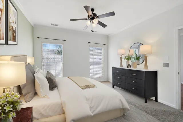 a bedroom with a bed and a dresser