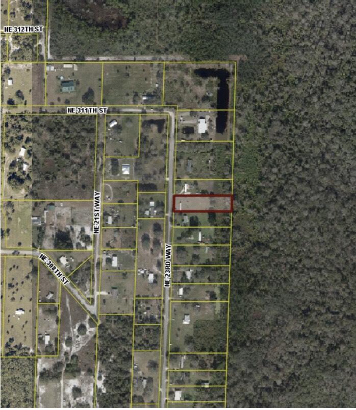 30910 Northeast 23rd Way Okeechobee, FL 34972 - Photo 2 of 8 a bathroom with a shower