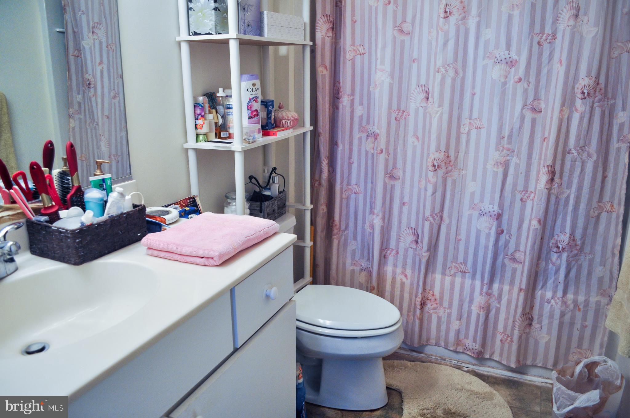 703 Canning House Row, Unit 902 Milton, DE 19968 - Photo 13 of 18 a room with a table and chairs