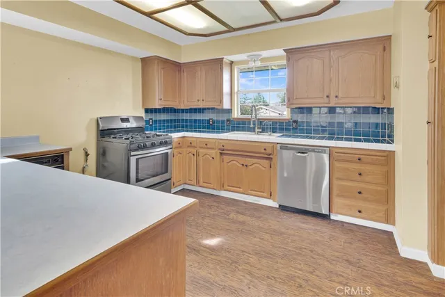 a view of a room with window and wooden floor