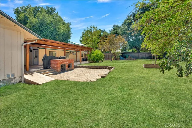 a kitchen with a stove top oven and white cabinets