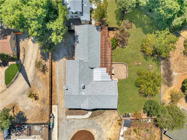 an aerial view of residential houses with city view