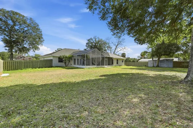 a view of a house with a big yard