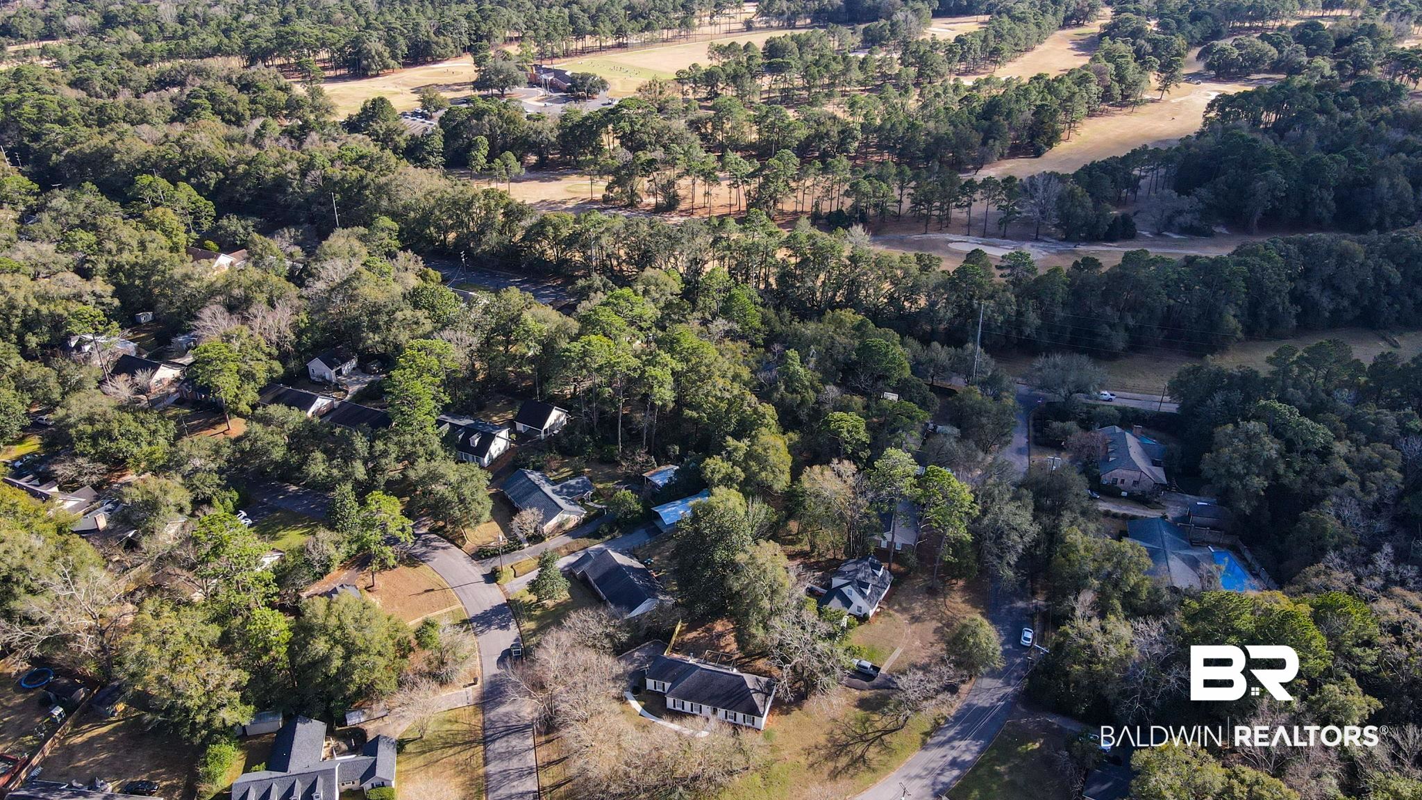 814 Nassau Drive Mobile, AL 36608 - Photo 40 of 44 Aerial view of property's location with a heavily wooded area