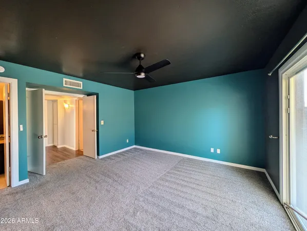 a view of an empty room with a window