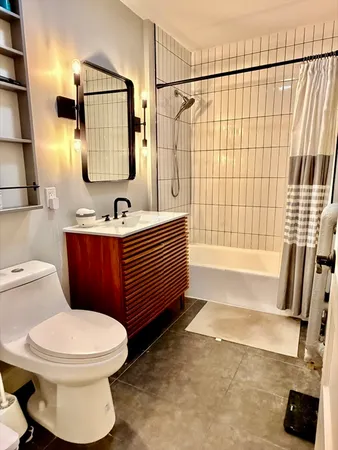 a bathroom with a toilet sink and bathtub