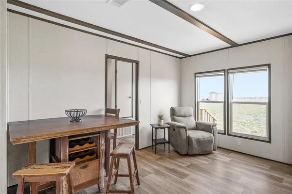 a workspace with furniture and window