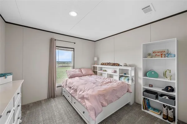 a bedroom with a bed and a cabinets