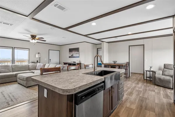 a view of a kitchen counter top space and living room