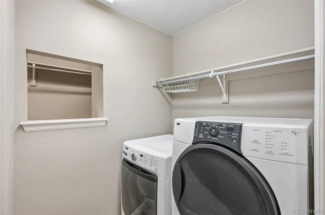 a utility room with dryer and washer