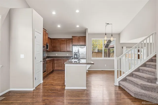 a kitchen with counter top space cabinets and stainless steel appliances