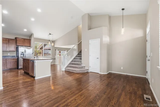 a view of kitchen with cabinets and wooden floor