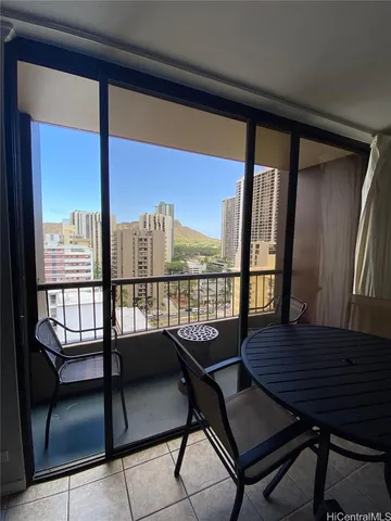a balcony with wooden floor outdoor seating and city view
