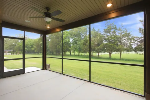 a view of an empty room with a large window