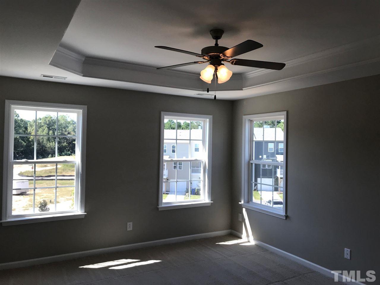 6419 Perry Creek Road Raleigh, NC 27616 - Photo 5 of 7 a view of an empty room with a window
