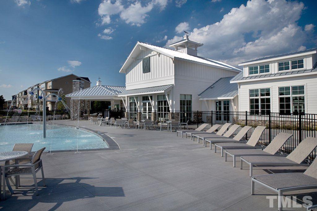 6419 Perry Creek Road Raleigh, NC 27616 - Photo 6 of 7 a view of patio with a table and chairs under an umbrella