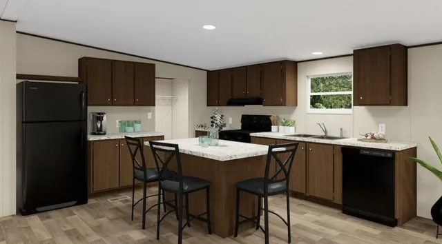 a kitchen with a table chairs refrigerator and cabinets