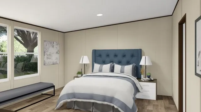 a bedroom with a large bed and a window