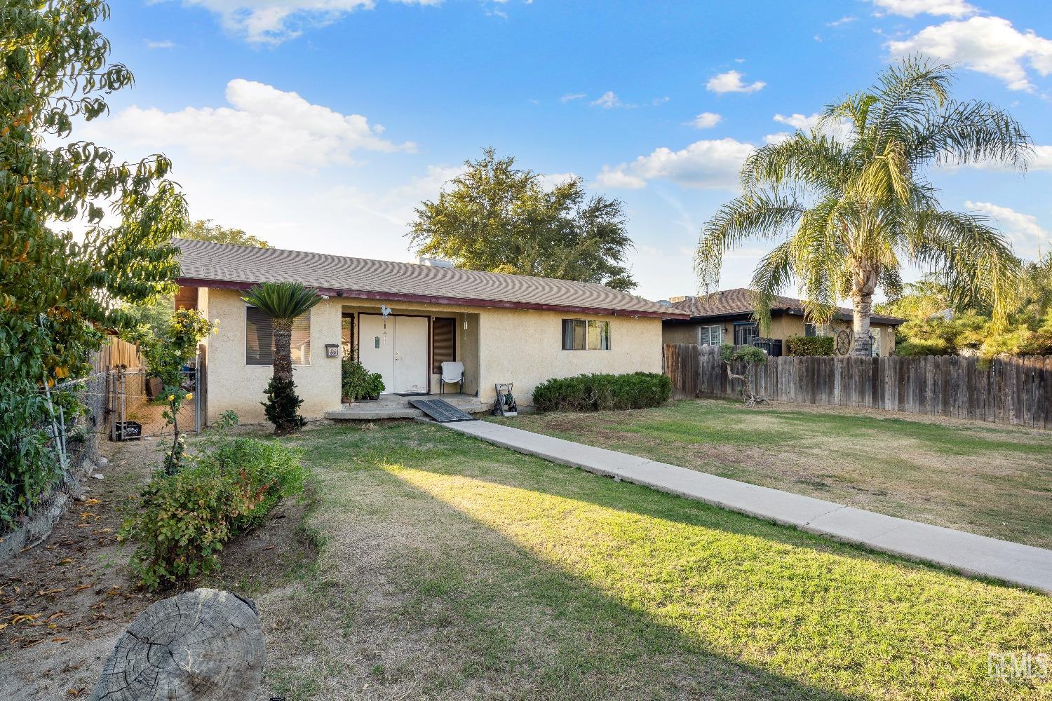 Undisclosed Address Delano, CA 93215 - Photo 3 of 10 a view of a house with swimming pool and a yard