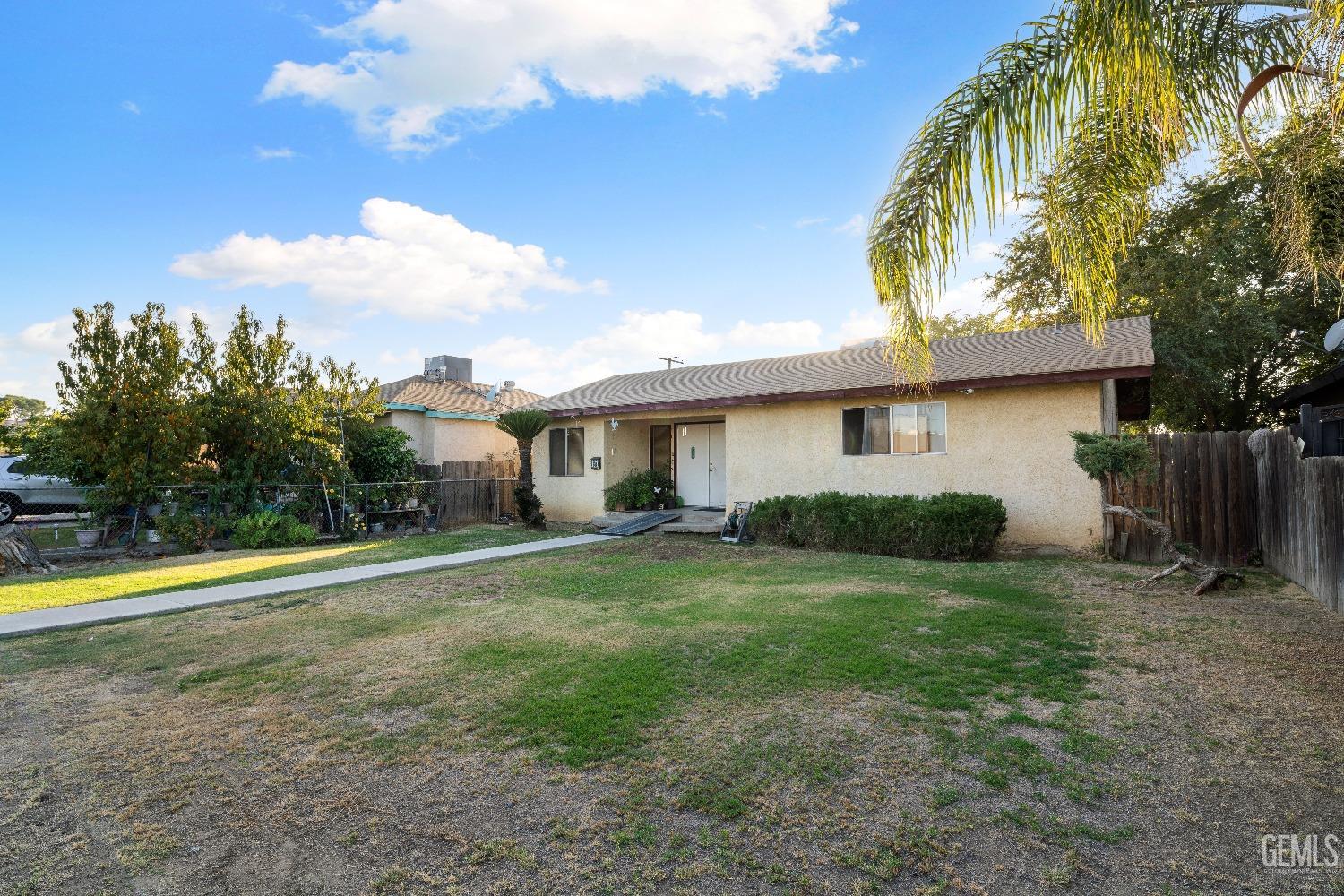 Undisclosed Address Delano, CA 93215 - Photo 4 of 10 a view of a house with a yard