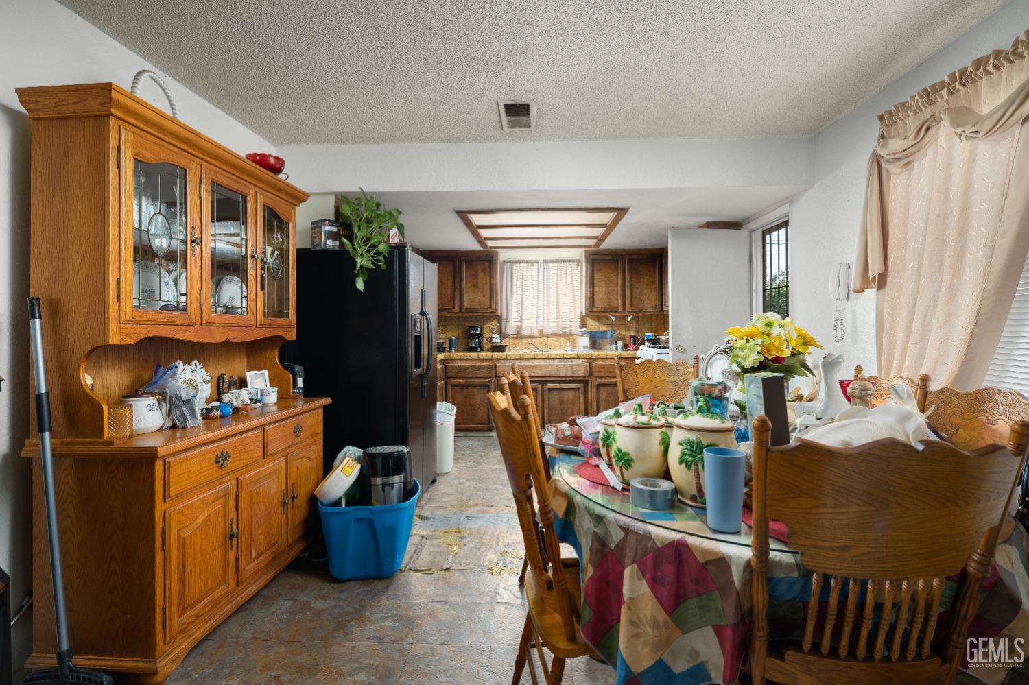 Undisclosed Address Delano, CA 93215 - Photo 8 of 10 a dining room filled with furniture and chandelier