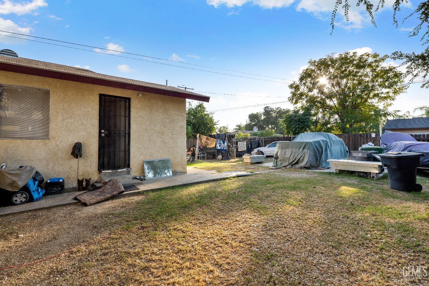 Undisclosed Address Delano, CA 93215 - Photo 10 of 10 a backyard of a house with barbeque oven table and chairs
