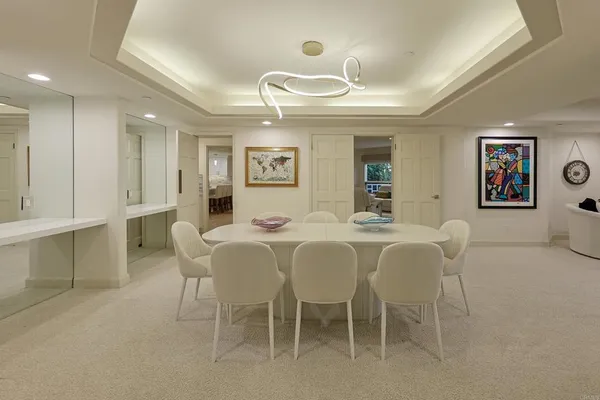 a dining room with furniture and window