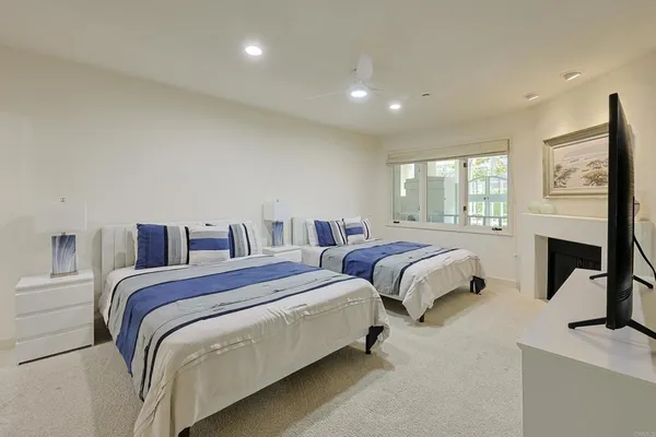 a bedroom with a bed and a large mirror