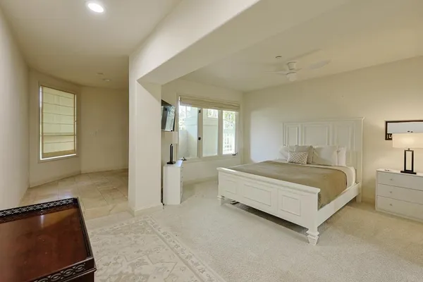 a view of a hallway with windows