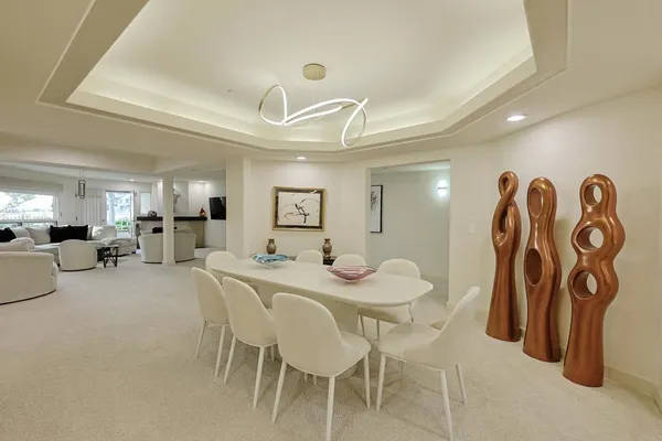 an empty room with closet and windows