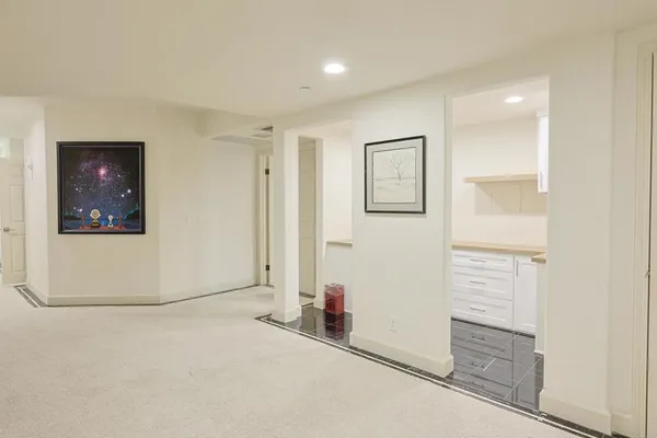a spacious bathroom with a double vanity sink a mirror and a bathtub