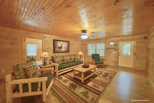 a living room with lots of furniture and wooden floor