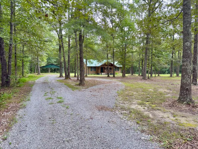 a view of a park with swings and trees