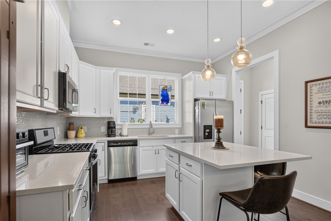 112 Tuttle Street Clemson, SC 29631 - Photo 15 of 46 Bright white cabinetry and stainless steel appliances adorn this functional, stylish kitchen.