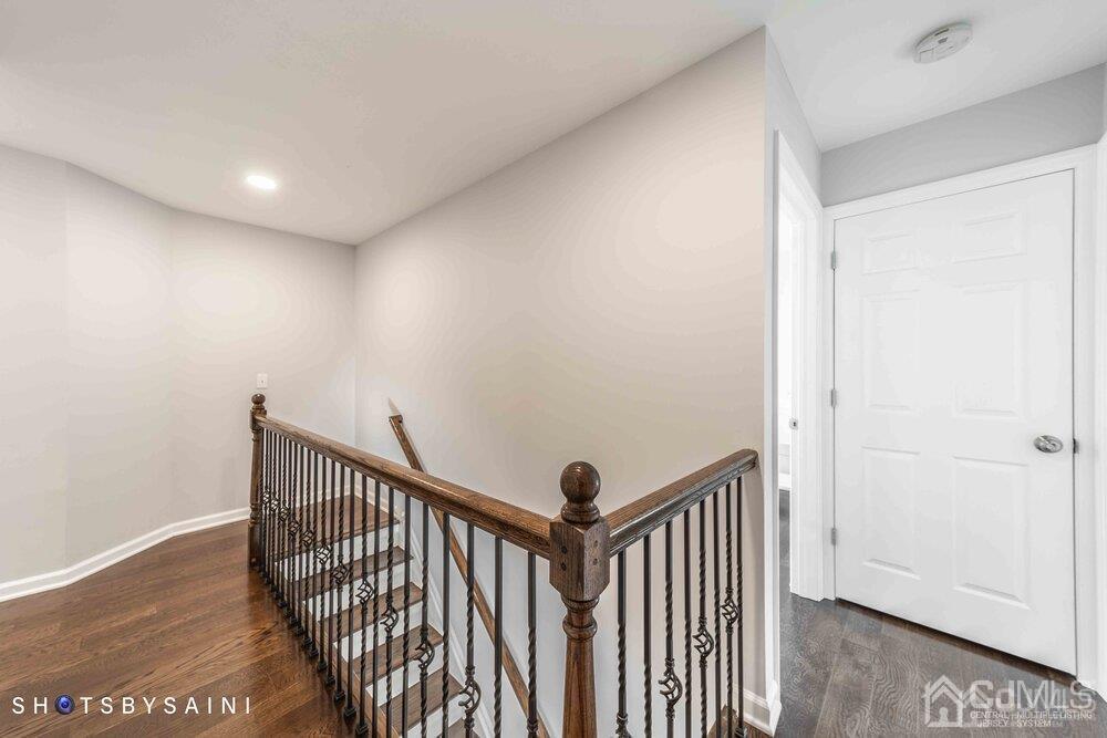 26 Richmond Road Edison, NJ 08817 - Photo 17 of 29 a view of a hallway with wooden floor and stairs